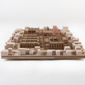 A model photo of an urban planning model of a small settlement in a flat area. MDF, wood, polyurethane.