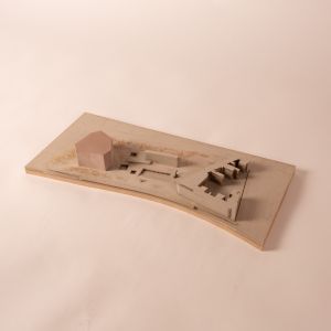 A model photo of a project in an urban planning context. MDF, grayboard, polyurethane.