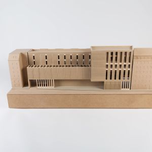 A model photo of a tenement building on a base. MDF, grayboard.