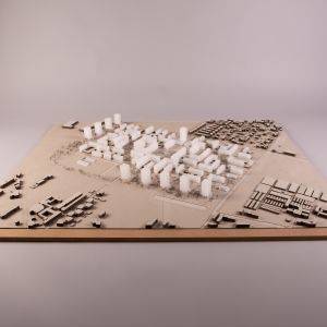 A model photo of an urban planning model of a dense urban area. MDF, grayboard, acrylic.