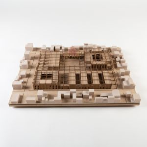 A model photo of an urban planning model of a small settlement in a flat area. MDF, wood, polyurethane.